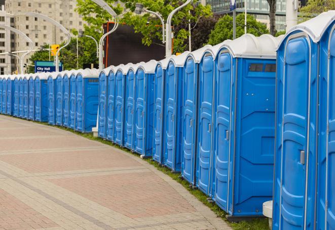 a row of portable restrooms at a fairground, offering visitors a clean and hassle-free experience in Hominy